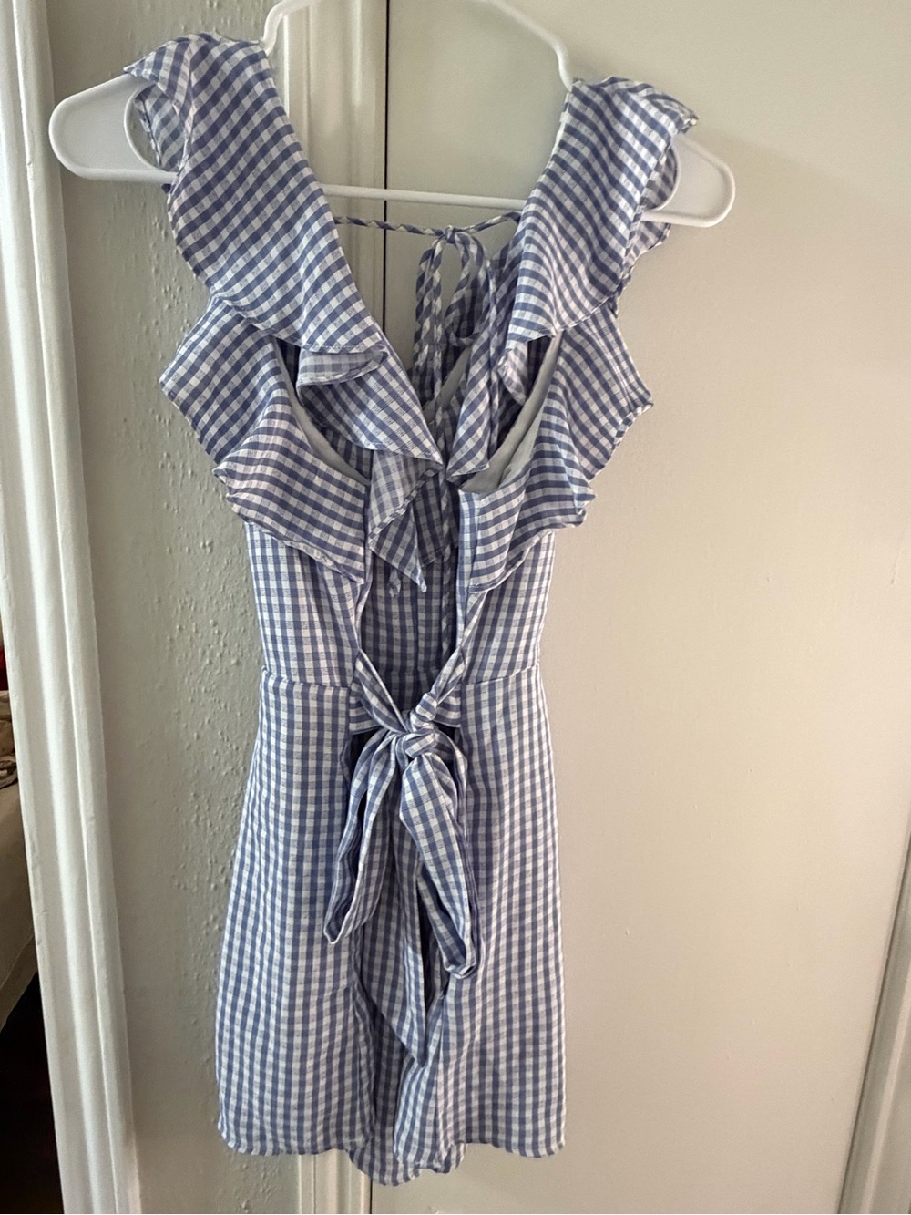 the clothing company Blue and White Gingham Ruffle Romper